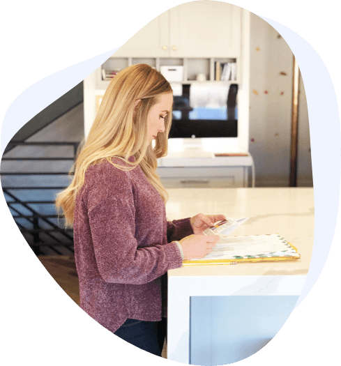 blonde woman reading mail